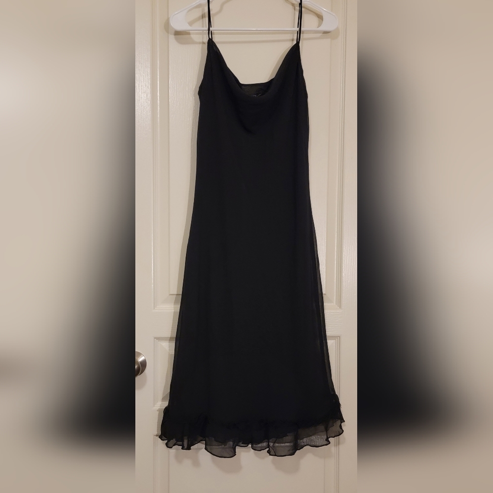 CDC black sleeveless dress with ruffle hem